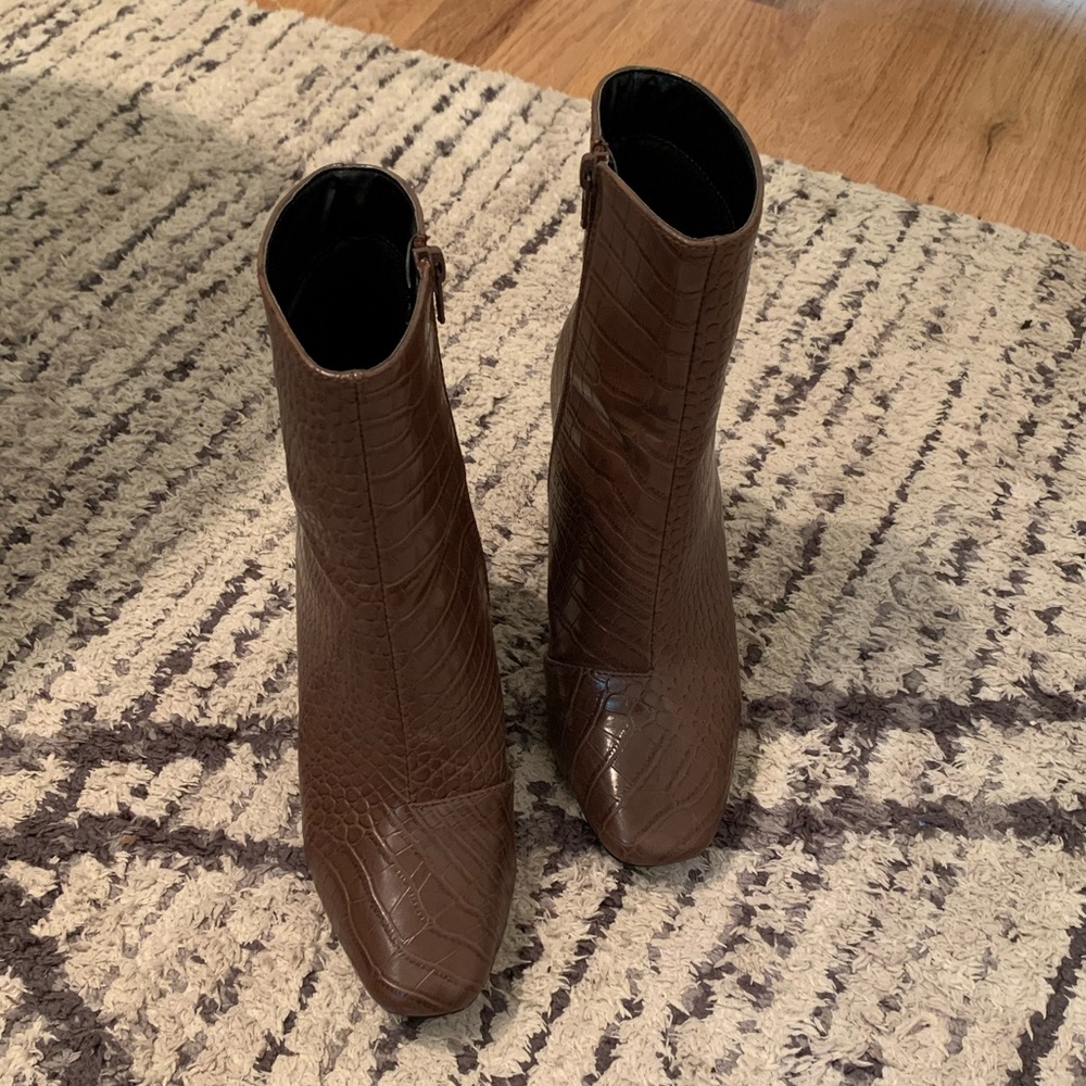 Lulu’s brown crocodile boots